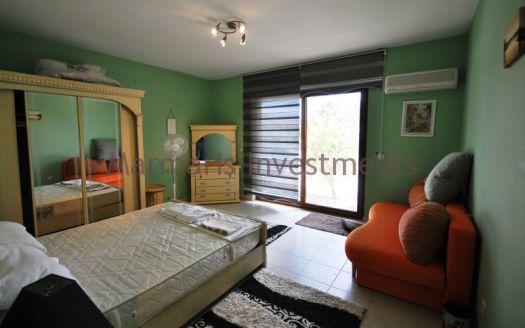 Stylish Modern Apartment for sale in Turunc with a communal swimming pool