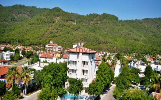 The 21 room hotel for sale with its outdoor restaurant and bar in Icmeler