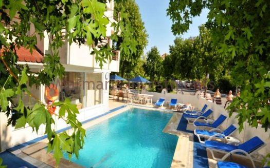 The 21 room hotel for sale with its outdoor restaurant and bar in Icmeler