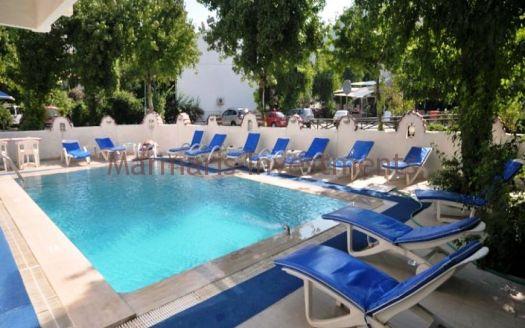 The 21 room hotel for sale with its outdoor restaurant and bar in Icmeler