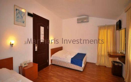 The 21 room hotel for sale with its outdoor restaurant and bar in Icmeler