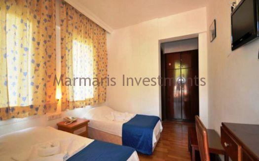 The 21 room hotel for sale with its outdoor restaurant and bar in Icmeler