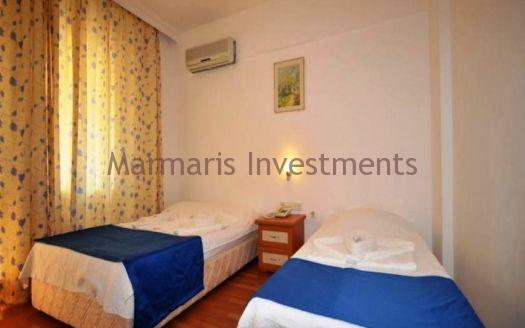 The 21 room hotel for sale with its outdoor restaurant and bar in Icmeler