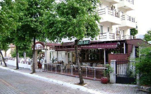 The 21 room hotel for sale with its outdoor restaurant and bar in Icmeler