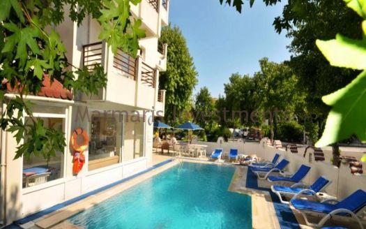 The 21 room hotel for sale with its outdoor restaurant and bar in Icmeler