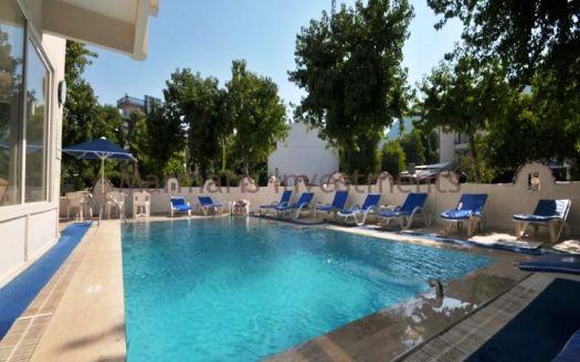 The 21 room hotel for sale with its outdoor restaurant and bar in Icmeler