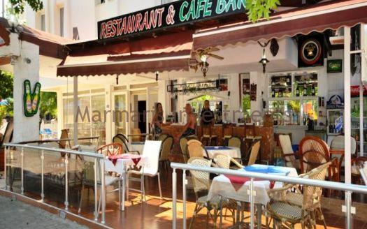 The 21 room hotel for sale with its outdoor restaurant and bar in Icmeler