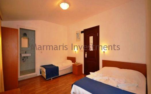 The 21 room hotel for sale with its outdoor restaurant and bar in Icmeler