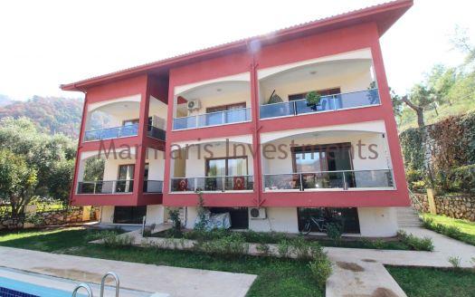 2 Bedroom and the family apartment available for sale within Icmeler with a pool is offered.