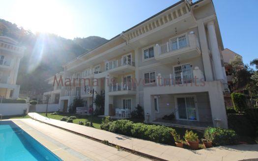 The Icmeler 3 bedroom apartment with a pool is now available for sale.