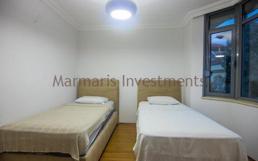 A luxury vacation home for sale in Marmaris Icmeler with a private swimming pool and garden