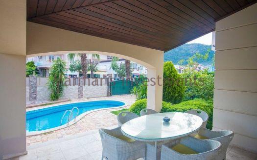 A luxury vacation home for sale in Marmaris Icmeler with a private swimming pool and garden