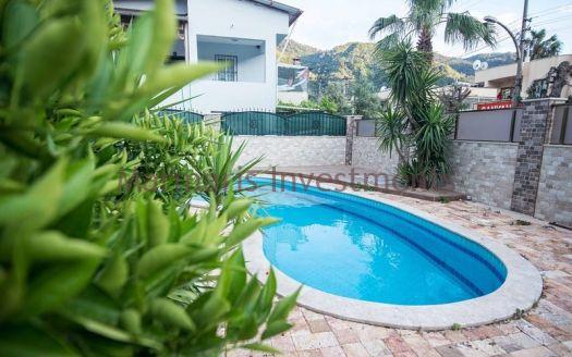 A luxury vacation home for sale in Marmaris Icmeler with a private swimming pool and garden