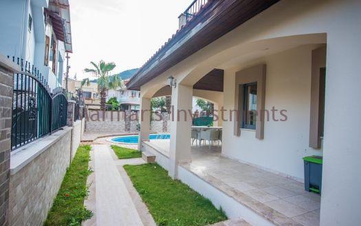 A luxury vacation home for sale in Marmaris Icmeler with a private swimming pool and garden