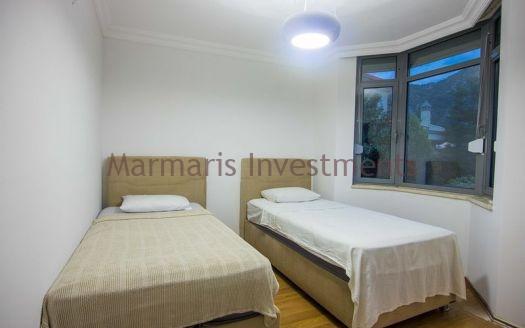 A luxury vacation home for sale in Marmaris Icmeler with a private swimming pool and garden