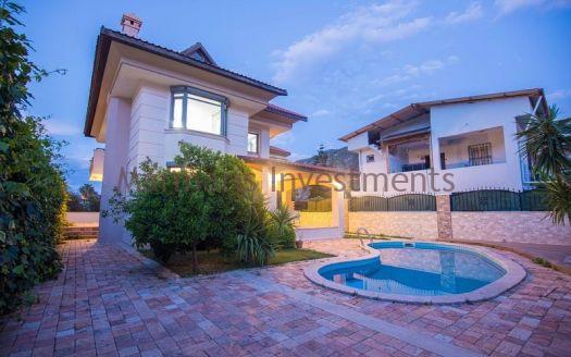A luxury vacation home for sale in Marmaris Icmeler with a private swimming pool and garden