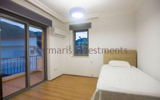 A luxury vacation home for sale in Marmaris Icmeler with a private swimming pool and garden