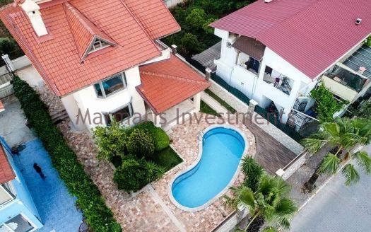 A luxury vacation home for sale in Marmaris Icmeler with a private swimming pool and garden