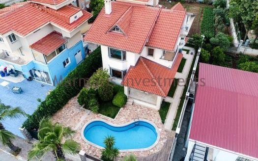A luxury vacation home for sale in Marmaris Icmeler with a private swimming pool and garden
