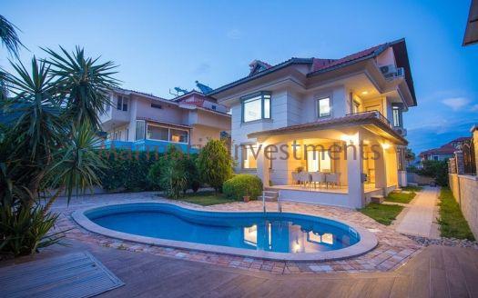 A luxury vacation home for sale in Marmaris Icmeler with a private swimming pool and garden