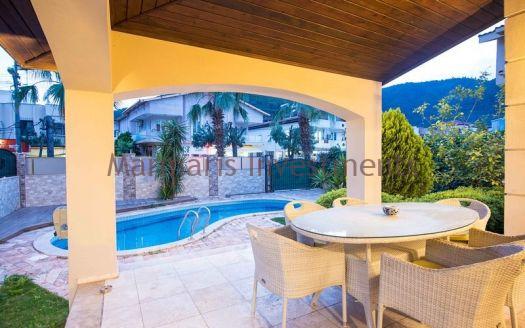 A luxury vacation home for sale in Marmaris Icmeler with a private swimming pool and garden